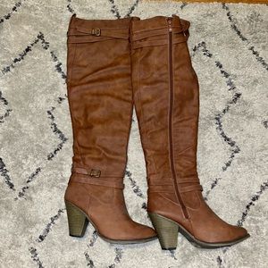 Brown knee high zip up heeled boots